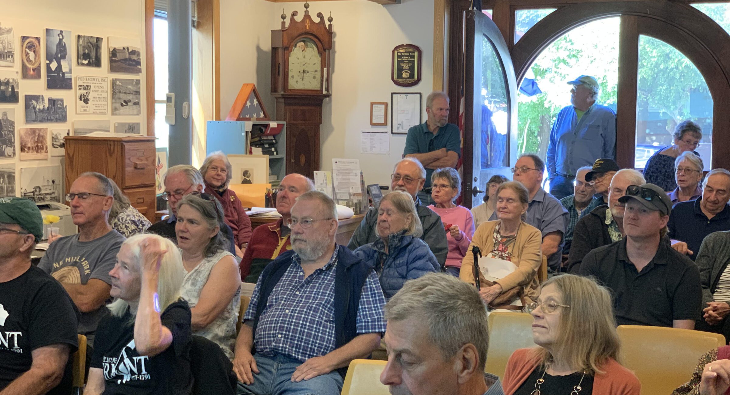 People attending a community event in a room.